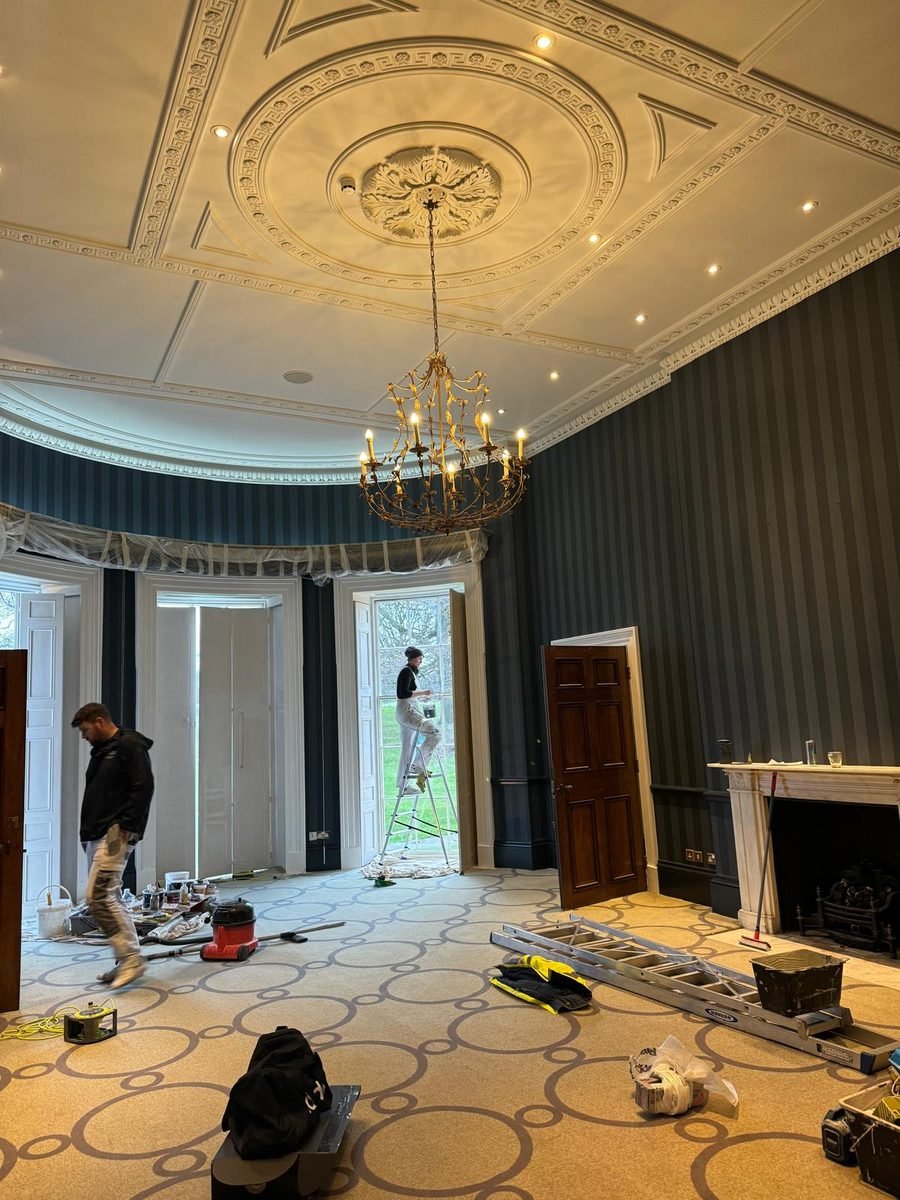 An MSR decorator at work on site, with protection down and the room prepared